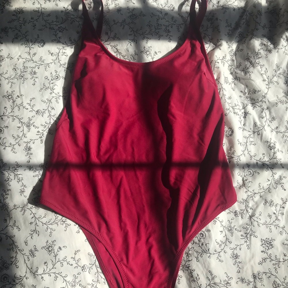Red cheeky one piece swim suit